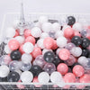 A white and pink ball pit filled with various sized clear, white, and pink plastic balls for toddlers.