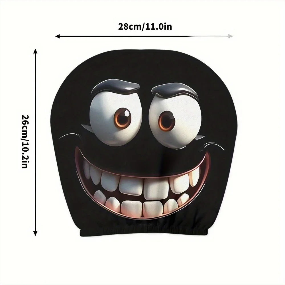 A black cushion cover featuring a cartoon smiley face with wide eyes and a large, toothy grin.