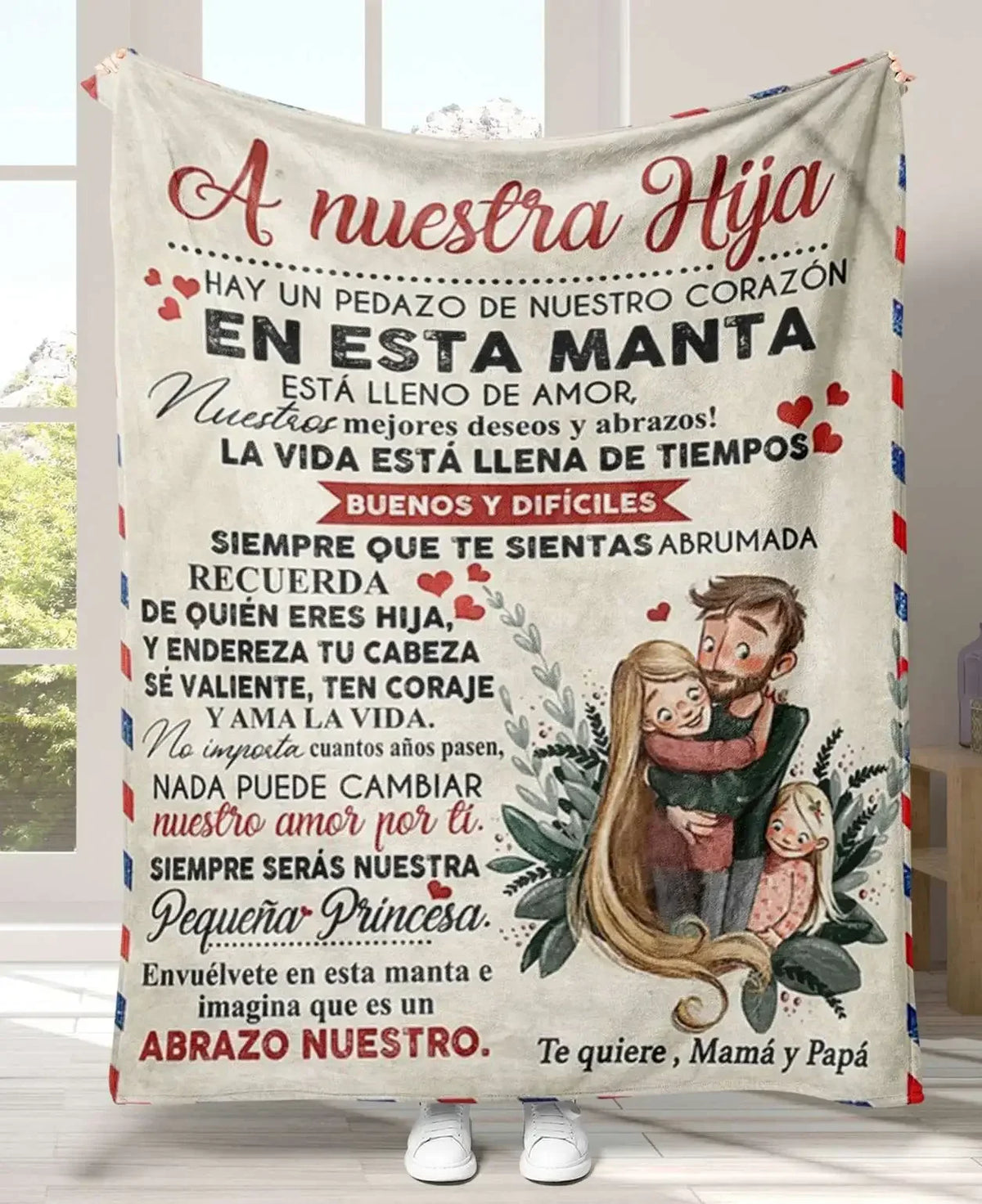 A personalized Spanish flannel throw blanket featuring text about a daughter, with an illustration of a family.