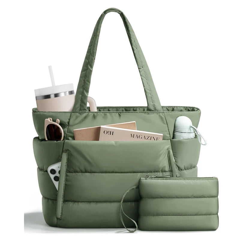 A quilted olive green puffy tote bag with a laptop sleeve and a straw cup inside.