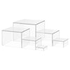 A set of clear acrylic display risers used for stacking desserts and party buffets.