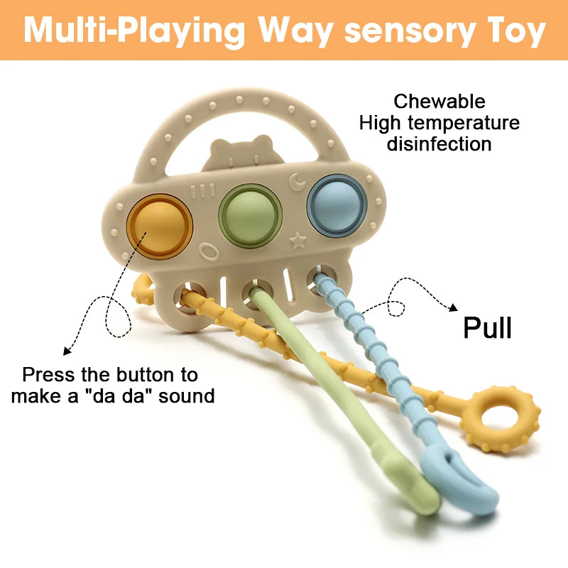 A silicone bear teether toy with a pull string and buttons for sensory play.