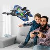 A boy is flying an EPP drop resistant stunt plane toy in a living room setting.