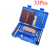 An open blue kit containing 33 pieces of tools for portable tire repair, including various wrenches and tools.