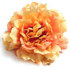 A bouquet of lifelike silk peony flower heads in shades of peach and yellow.