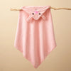 Pink quilted hooded baby bathrobe towel with a cute cartoon animal design hanging on a wooden branch