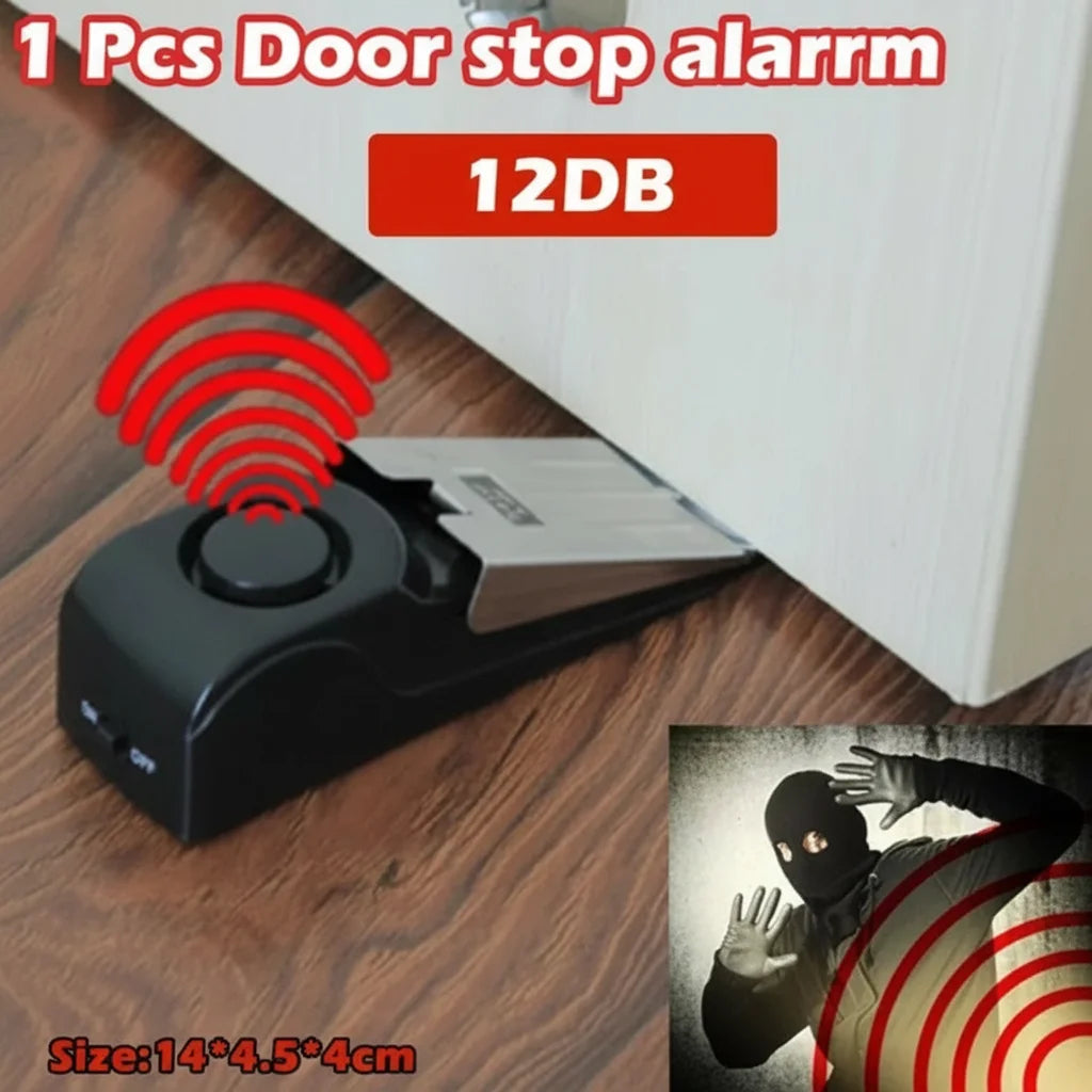 A black wireless door stop alarm device with a red signal emanating from it, shown next to a close-up of a hand with a simila