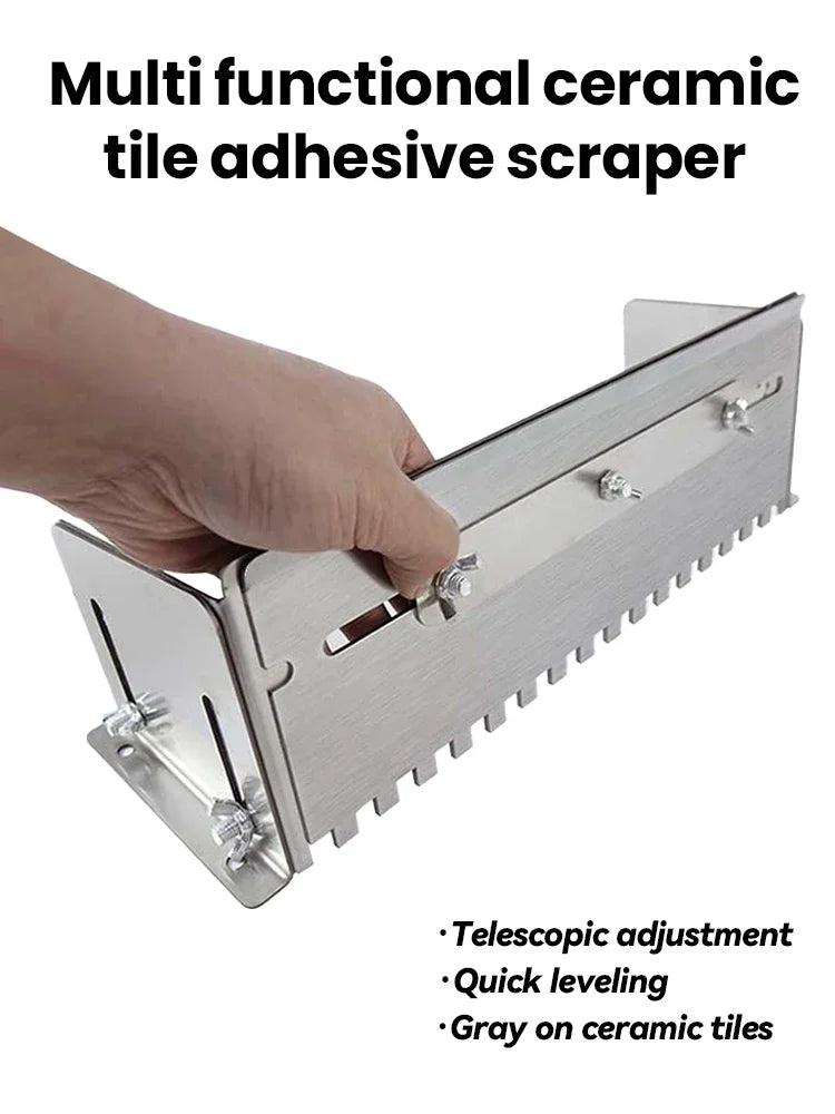 A hand is using a multi functional ceramic tile adhesive scraper with a telescopic adjustment feature on gray ceramic tiles.