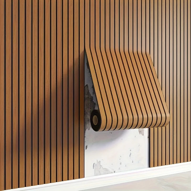 A close-up of wood grain peel-and-stick wall tiles installed vertically on a beige wall.