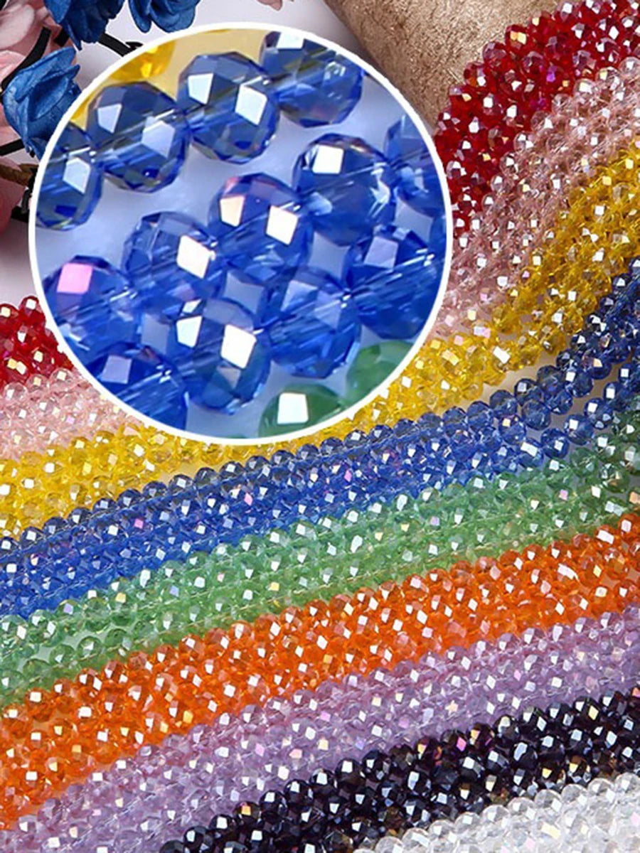 Assortment of faceted crystal glass spacer beads in various colors including blue, green, orange, and purple.