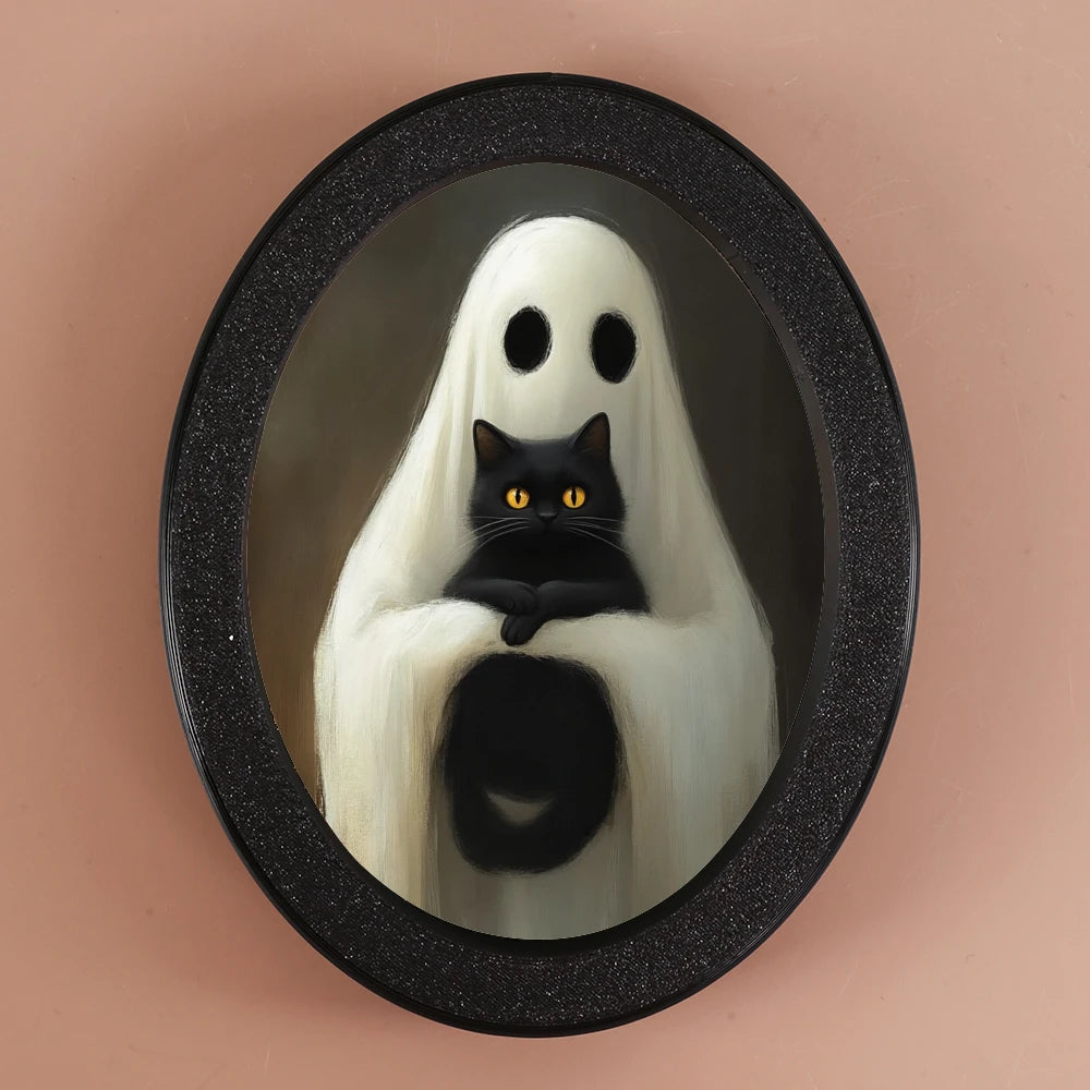 An oval decorative ornament featuring a ghost figure with white drapery and a black cat.