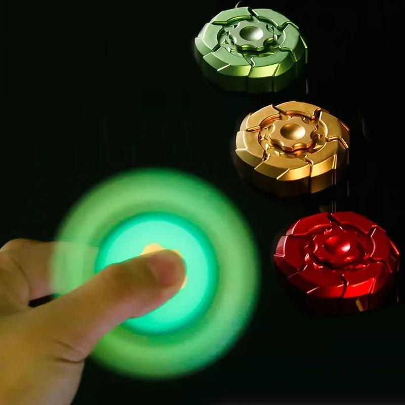 A hand is interacting with a magnetic fidget slider featuring green, gold, and red colored discs.