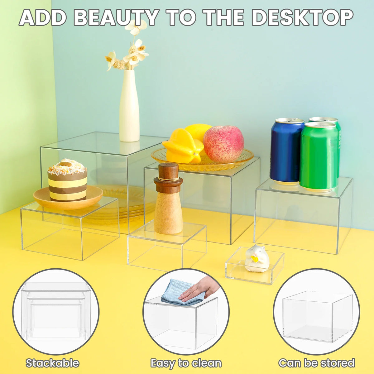 Stackable acrylic display risers used to elevate desserts and party items on a desktop.