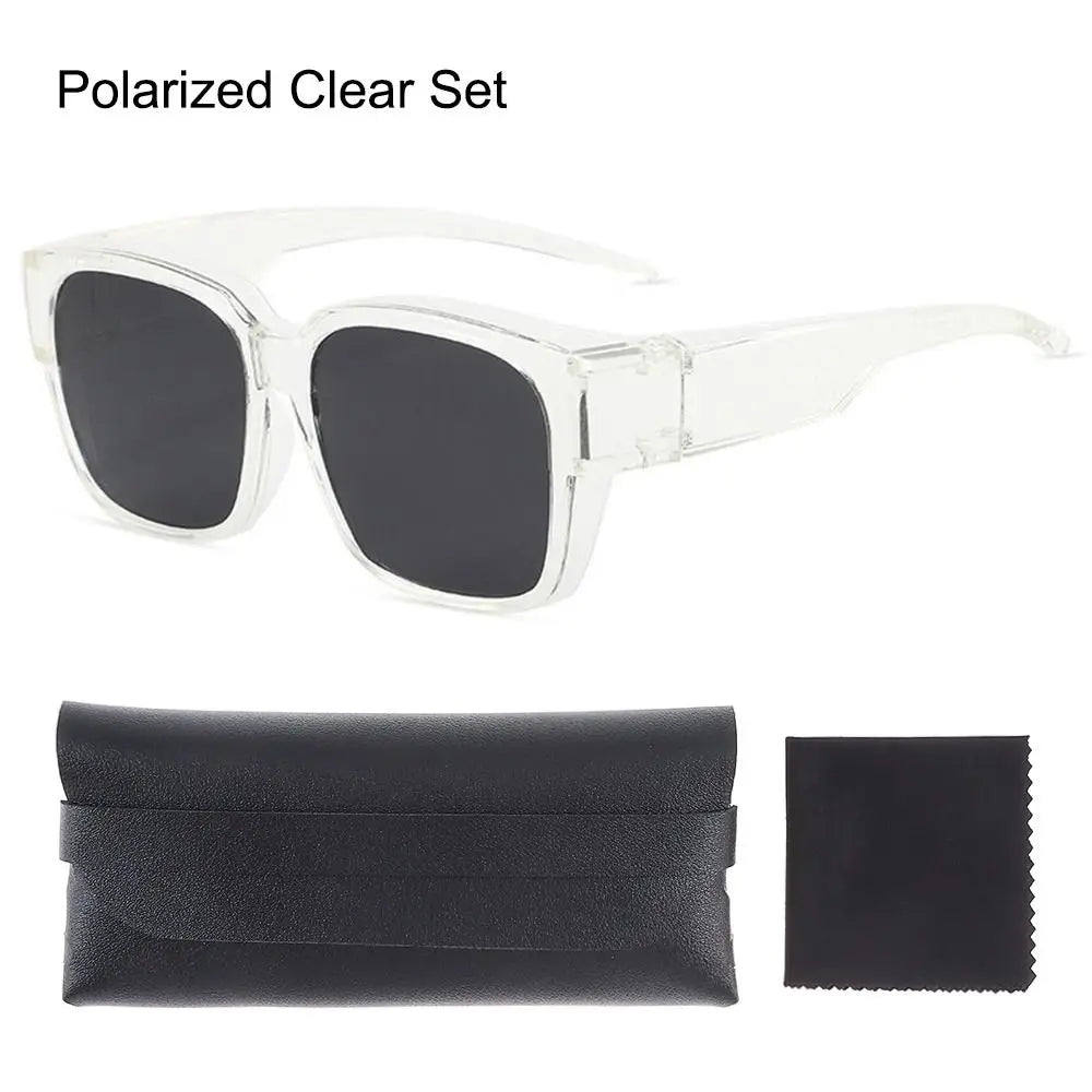 A clear polarized sunglasses set including a pair of fit-over sunglasses and a black folding case.