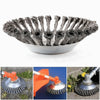 A collection of steel wire wheel brushes used for string trimmers, shown in various angles.
