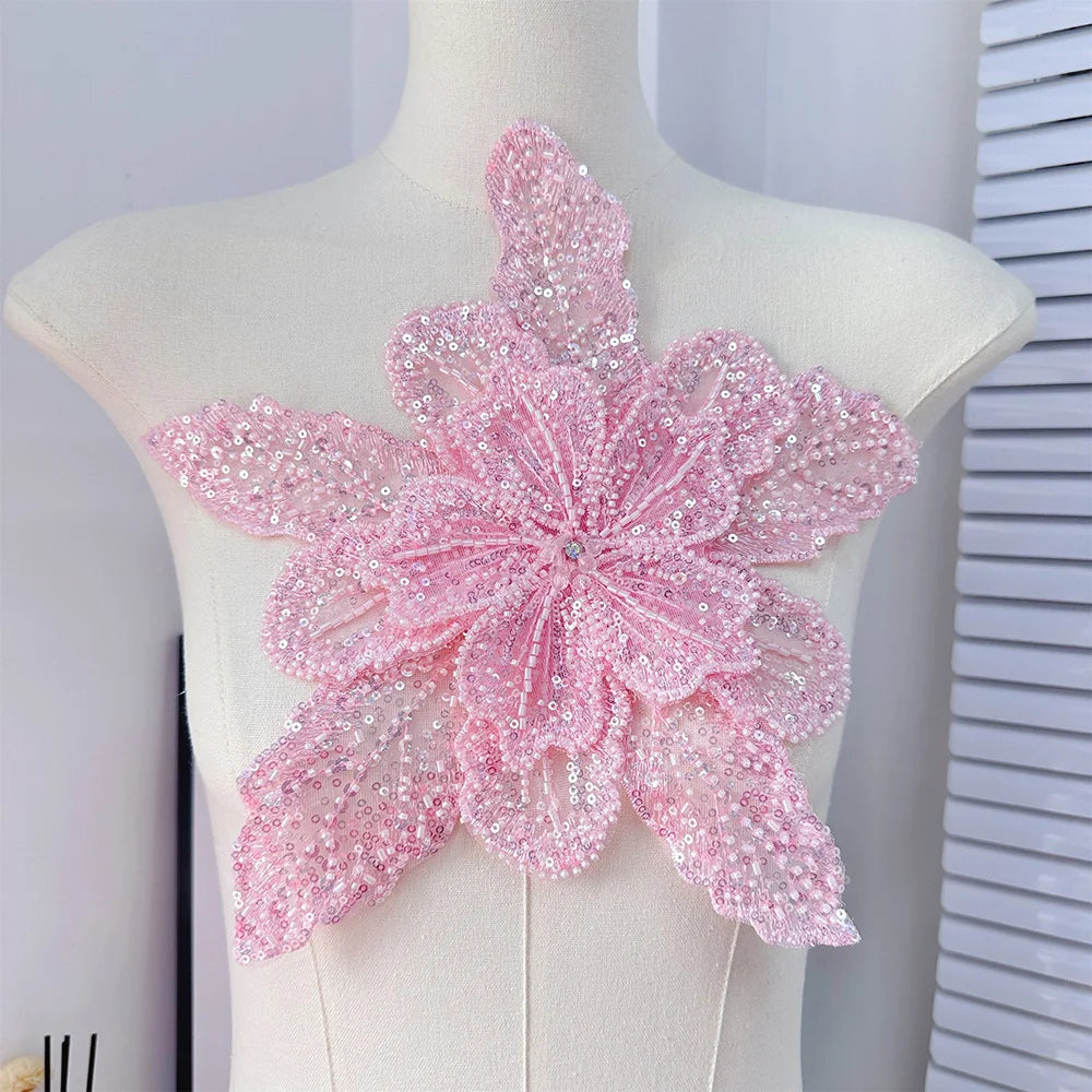 Pink sequin floral lace applique patch for sewing and DIY crafts displayed on a mannequin.