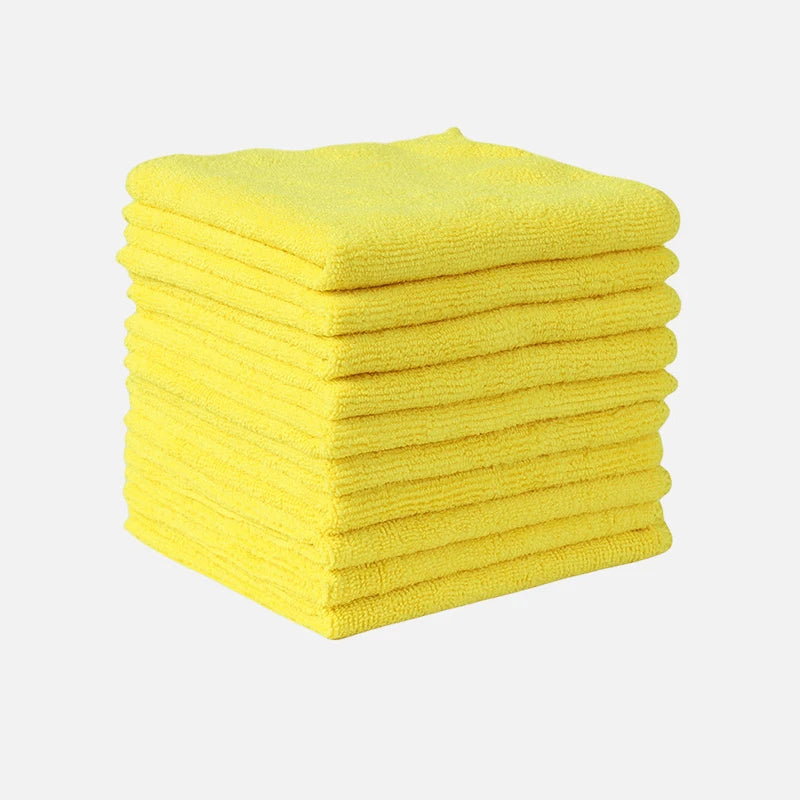 A stack of bright yellow thickened microfiber cleaning towels.