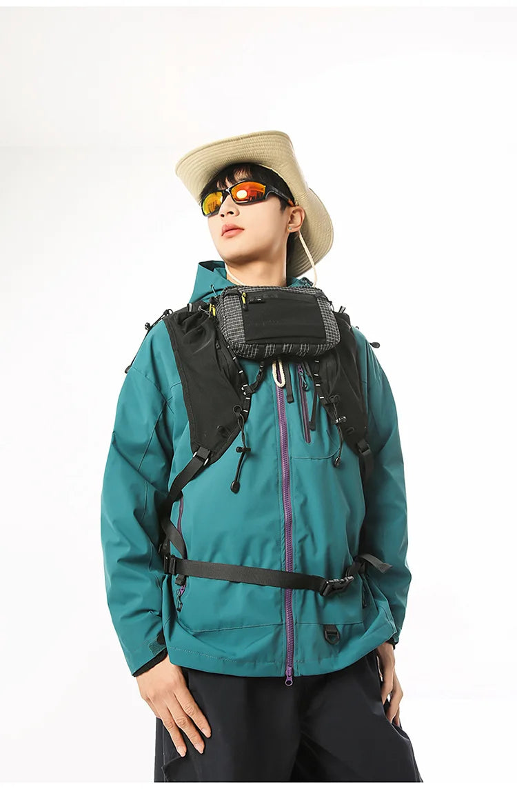 A person wearing a teal waterproof tactical waist bag and a straw hat looking forward.