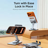 An orange and silver aluminum alloy friction rotation mount phone stand is shown on a wooden table.