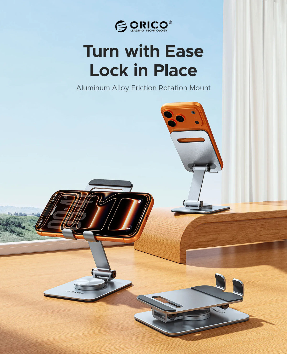 An orange and silver aluminum alloy friction rotation mount phone stand is shown on a wooden table.