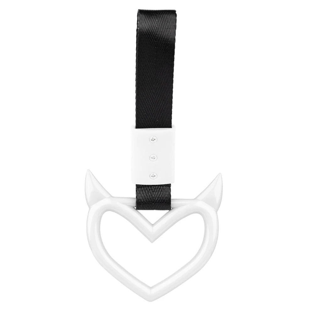 A white heart-shaped ring drift handle with a black strap.