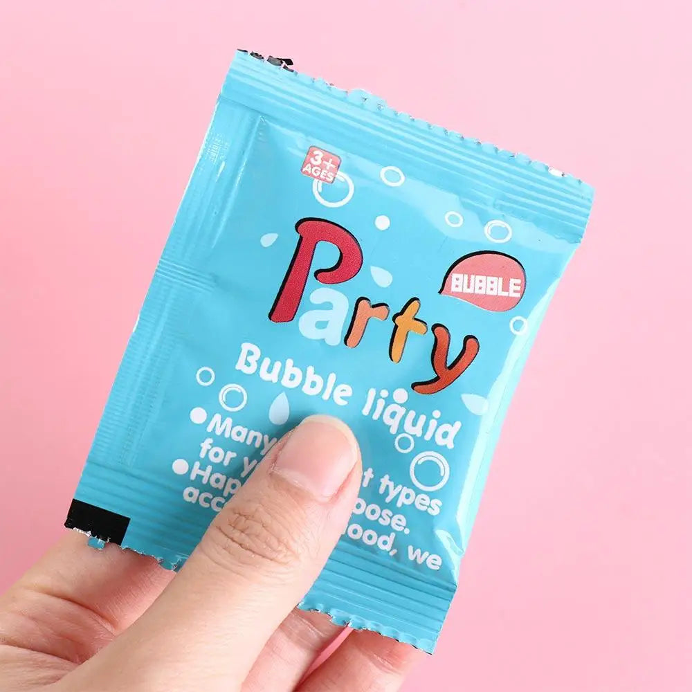 A hand holds a blue squeeze tube of Party Bubble liquid for kids.