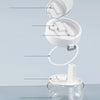 A white portable denture case is shown open, displaying storage compartments for dentures and a cleaning brush.