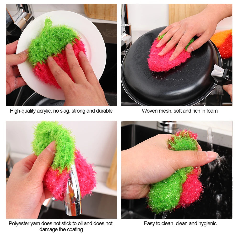Close-up of a pink strawberry scrubber sponge being used to clean dishes and kitchen items.
