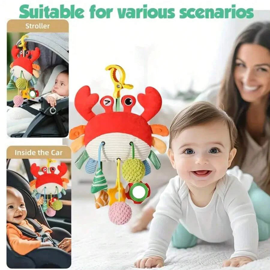 A hanging baby rattle and teether toy with a cartoon pendant is shown in various scenarios, including a stroller and inside a