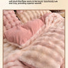 A pink plush bedding set featuring thick velvet fleece fabric for warmth and comfort.