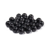 A pile of round black ABS imitation pearl beads for jewelry making