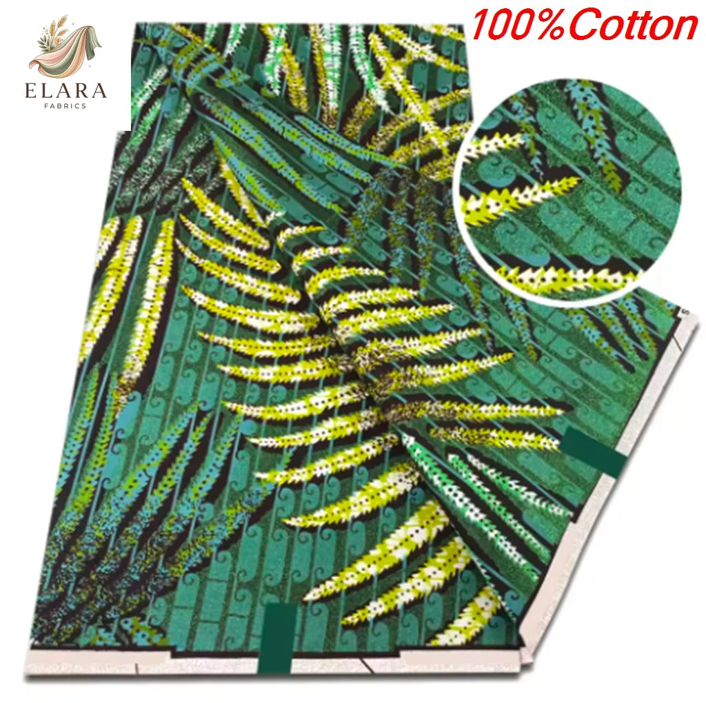 Green and yellow African wax print fabric featuring a dense pattern of leaves and branches