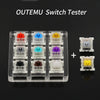 A set of Outemu Switch Testers showing various colored mechanical keyboard switches arranged in compartments.