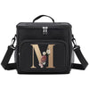 Black insulated canvas lunch bag with a gold initial M and floral embroidery