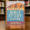 A spiral-bound Bible study guide with a cover featuring an arid landscape and text titled Beginner's Bible Study Guide