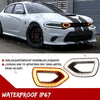 Close-up of a white Dodge Charger grille with aftermarket LED lights installed.