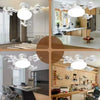 Modern white LED ceiling fan with multiple light heads and remote control features in a kitchen setting.