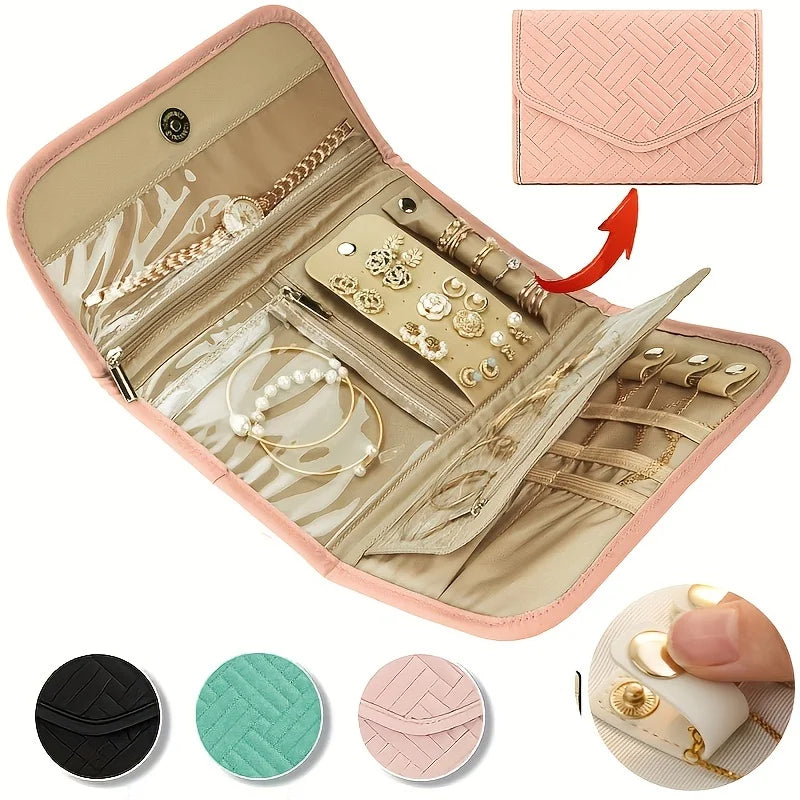 A pink foldable waterproof jewelry roll with compartments for storing and traveling with accessories.