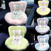 A collection of colorful miniature doll seat car vent decorations in pink, yellow, and lime green.