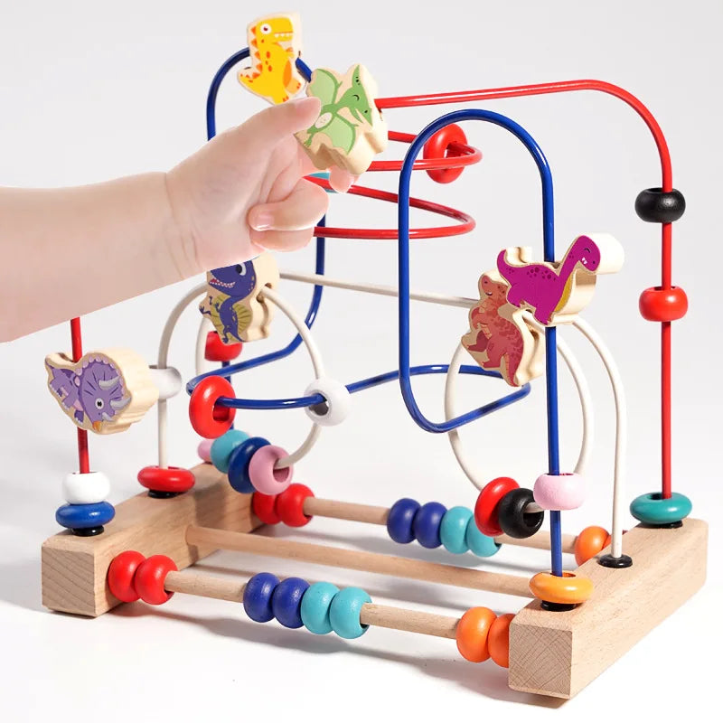 A hand is manipulating a wooden bead maze toy with colorful beads and maze paths.