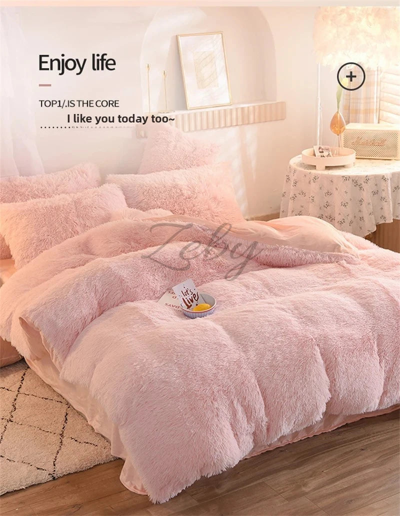 A pink plush mink velvet duvet cover set displayed on a bed with soft lighting.