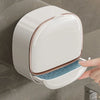 A white wall-mounted ABS soap dish with a lid is shown being opened by a hand.