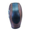 A close-up view of a black carbon fiber gear shift knob cover with orange stitching.