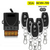 A black relay switch module with a battery included and multiple wireless remote controls attached by chains.