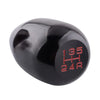A glossy black gear shift knob with red markings indicating 135, HH, and 24R.