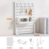 White desktop pegboard organizer featuring multiple hooks and shelves for various items