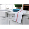White kitchen towels with red stripes are displayed on a countertop next to a sink and blue plates.