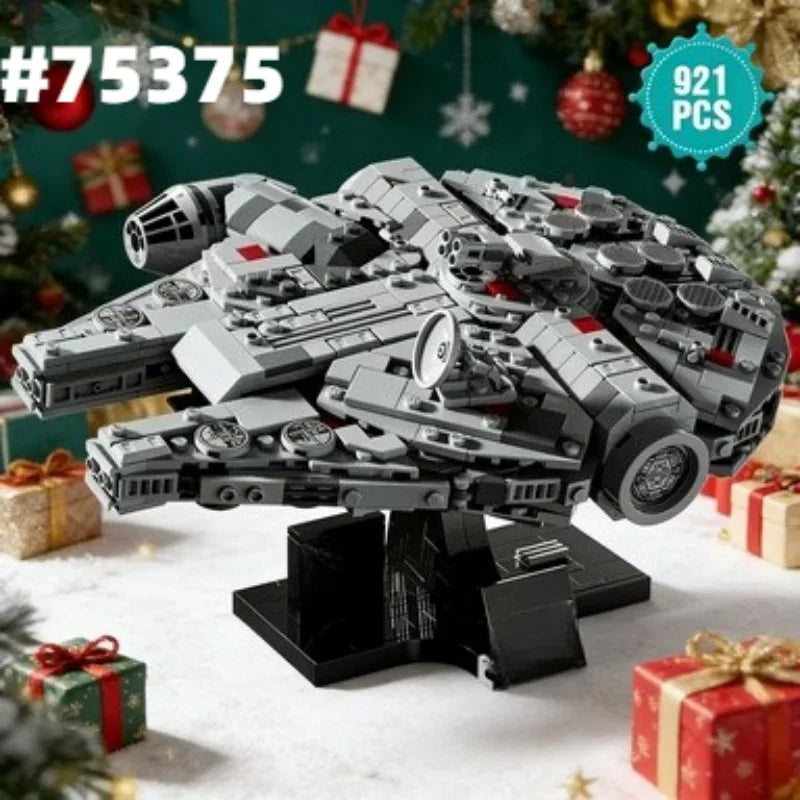 Modelo de bloques gris del nave Millennium Falcon con regalos festivos sobre una superficie blanca.