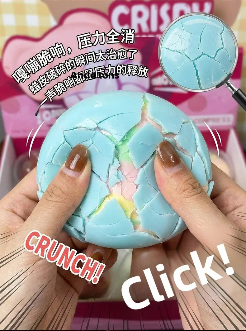 Hands squeeze a cracked light blue squishy stress ball under a magnifying glass.
