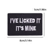 Black embroidered iron-on patch with white text that reads I'VE LICKED IT IT'S MINE
